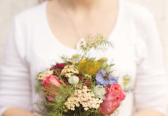 woman holding flowers