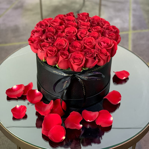 Red roses arrangement in a medium luxury round box - Upscale and Posh - Same Day Flower Delivery Dubai