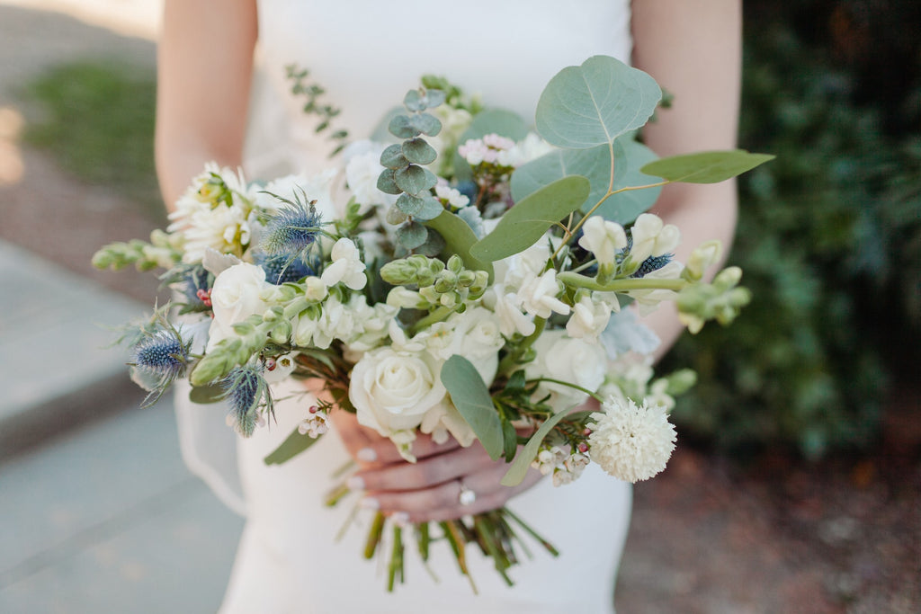 holding wedding flowers