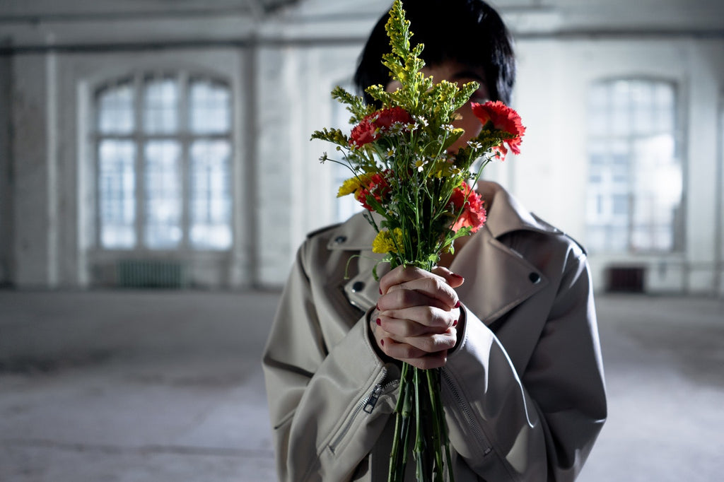 holding fresh flowers